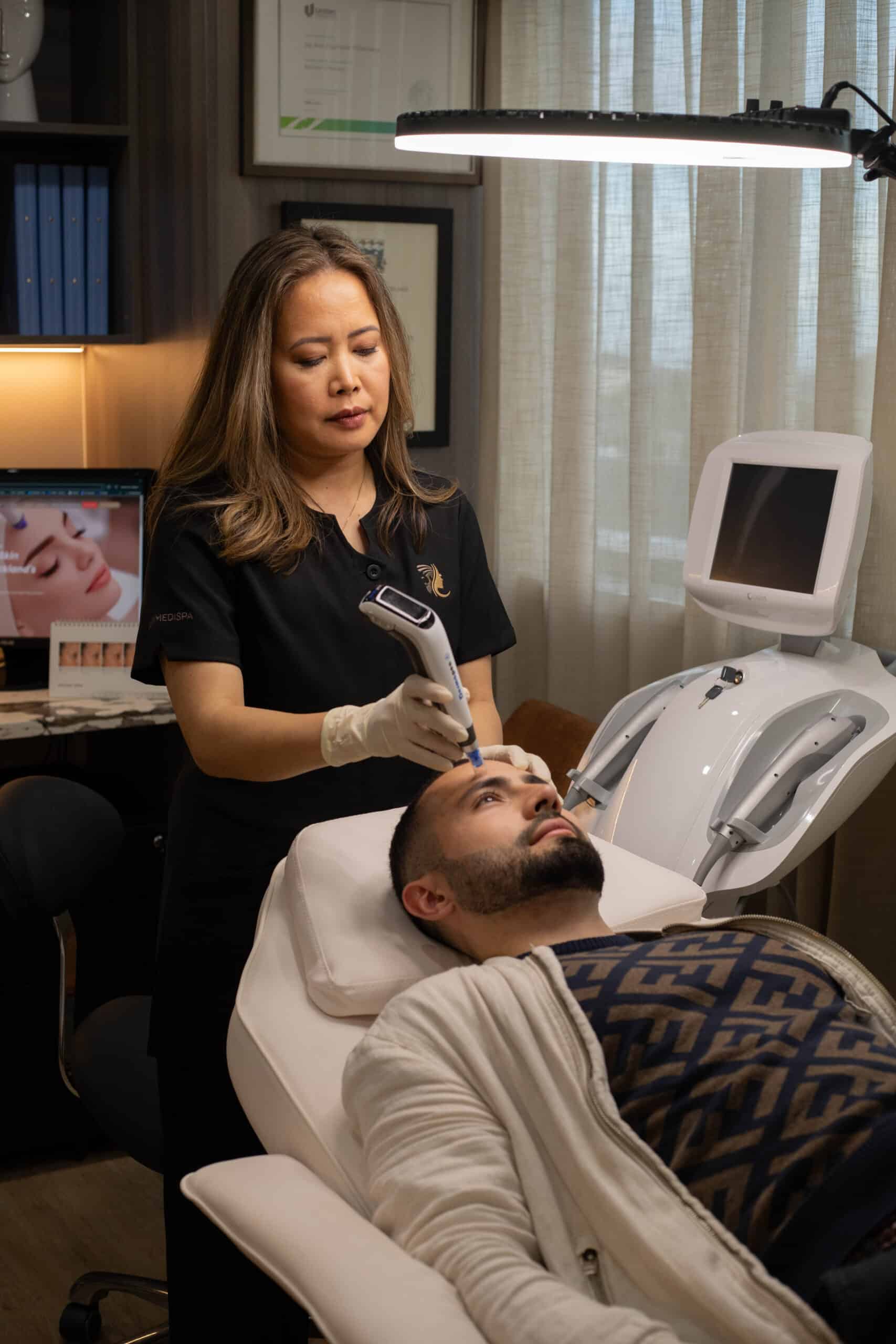 Jay Ann using Dermapen to her patient 2